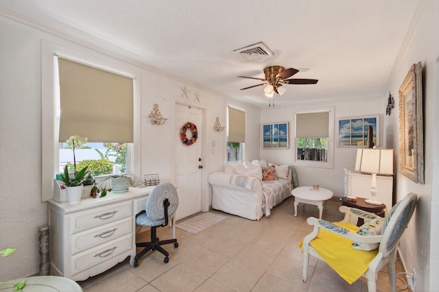 406 N D St, Lake Worth Beach, FL 33460 - bedroom with light tile patterned floors, ornamental molding, built in desk, and a ceiling fan