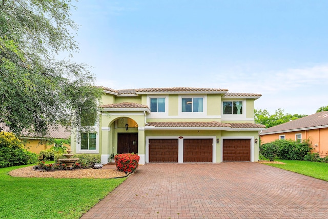5783 NW 48th Ct, Coral Springs, FL 33067 - mediterranean / spanish-style home featuring decorative driveway, stucco siding, an attached garage, and a tiled roof