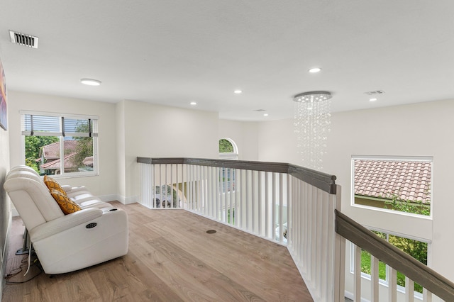 5783 NW 48th Ct, Coral Springs, FL 33067 - living area with an upstairs landing, wood finished floors, recessed lighting, and a chandelier