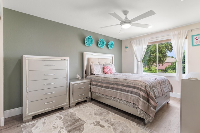5783 NW 48th Ct, Coral Springs, FL 33067 - bedroom with light wood-type flooring and a ceiling fan