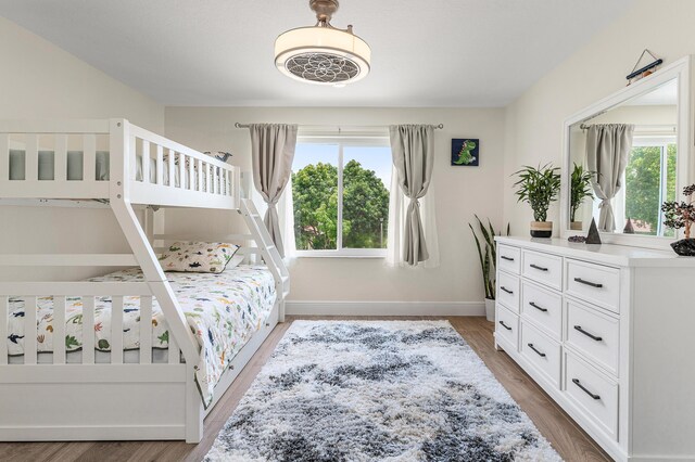 5783 NW 48th Ct, Coral Springs, FL 33067 - bedroom with wood finished floors and baseboards