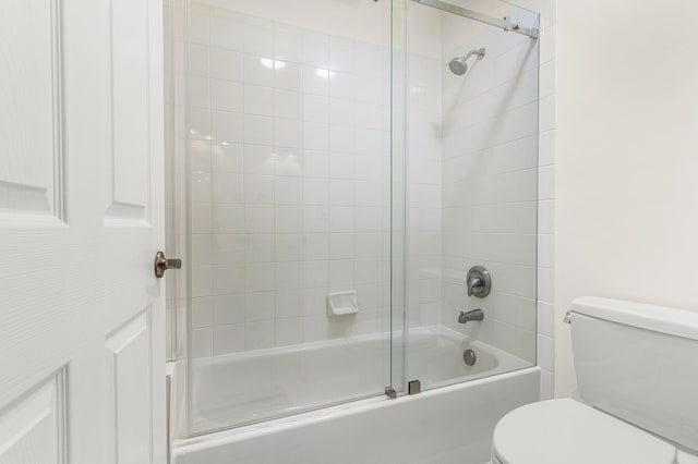 5783 NW 48th Ct, Coral Springs, FL 33067 - bathroom featuring toilet and combined bath / shower with glass door