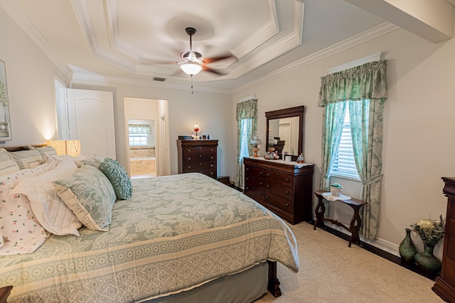 5927 NW Favian Ave, Port Saint Lucie, FL 34986 - bedroom with a raised ceiling, ornamental molding, carpet floors, ensuite bathroom, and a ceiling fan