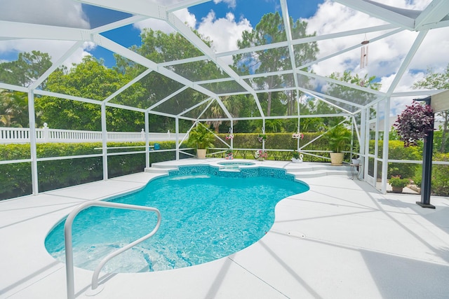 5927 NW Favian Ave, Port Saint Lucie, FL 34986 - view of swimming pool with a patio area, a pool with connected hot tub, and glass enclosure