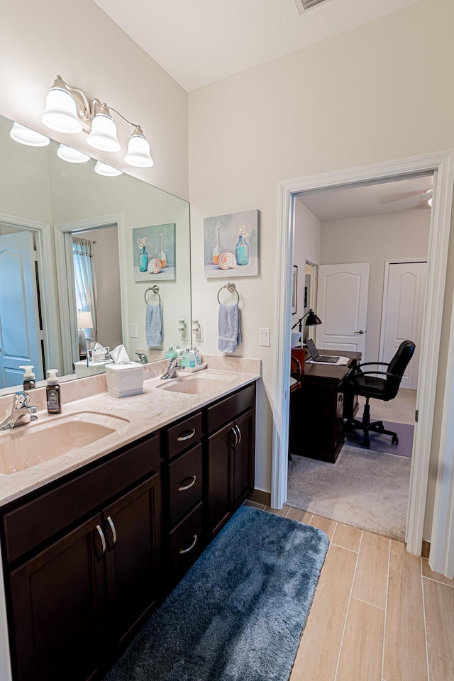 5927 NW Favian Ave, Port Saint Lucie, FL 34986 - full bath featuring double vanity and wood tiled floors