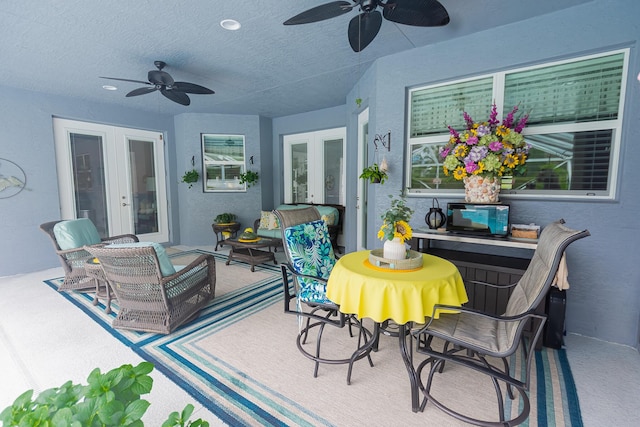 5927 NW Favian Ave, Port Saint Lucie, FL 34986 - view of patio / terrace with french doors, ceiling fan, and an outdoor living space
