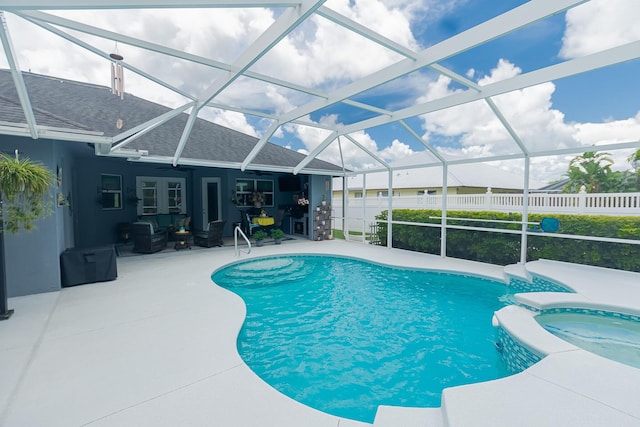 5927 NW Favian Ave, Port Saint Lucie, FL 34986 - view of pool featuring a patio, a pool with connected hot tub, and glass enclosure