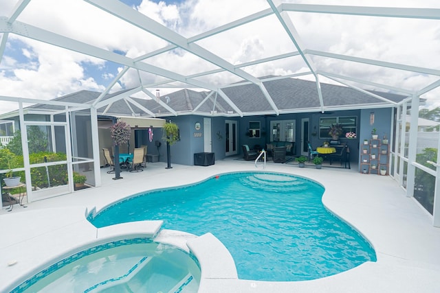 5927 NW Favian Ave, Port Saint Lucie, FL 34986 - view of pool with a patio area, a pool with connected hot tub, glass enclosure, and ceiling fan