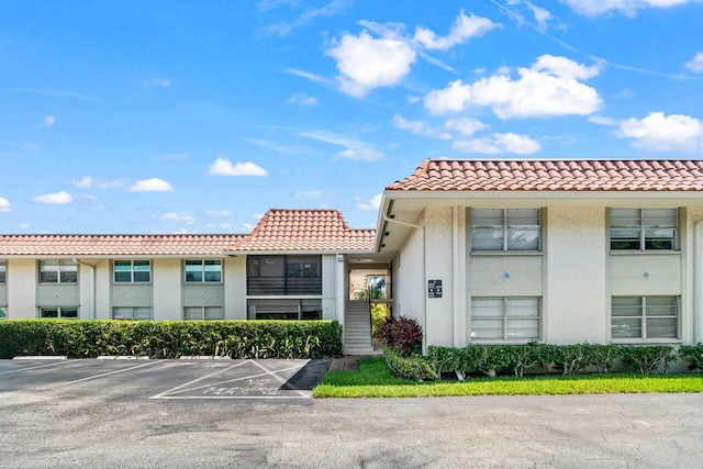 1124 NW 13th St Unit 204A, Boca Raton, FL 33486 - view of property featuring uncovered parking