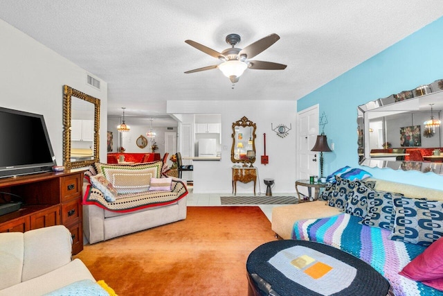 1124 NW 13th St Unit 204A, Boca Raton, FL 33486 - living room featuring a ceiling fan, a textured ceiling, and a chandelier