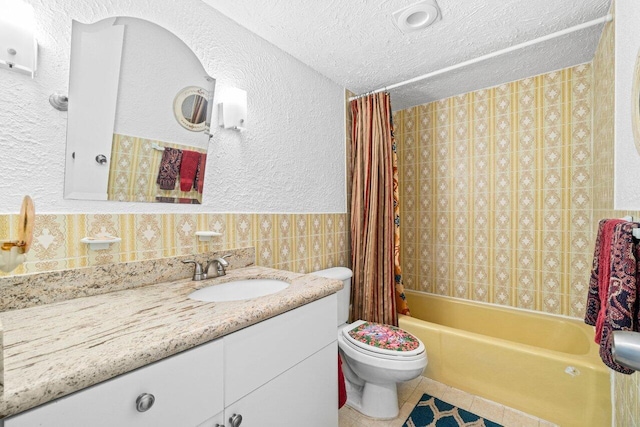 1124 NW 13th St Unit 204A, Boca Raton, FL 33486 - bathroom featuring vanity, a textured ceiling, shower / tub combo, tile patterned flooring, and tile walls