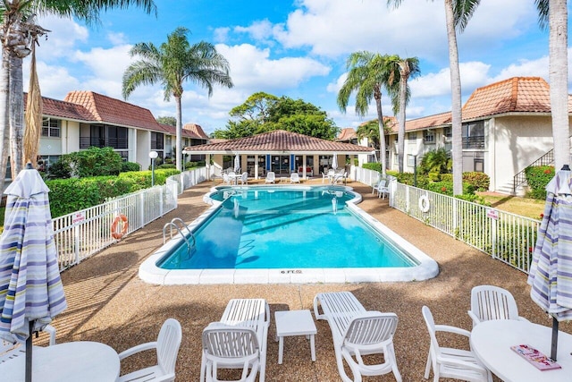 1124 NW 13th St Unit 204A, Boca Raton, FL 33486 - community pool featuring a patio and a residential view