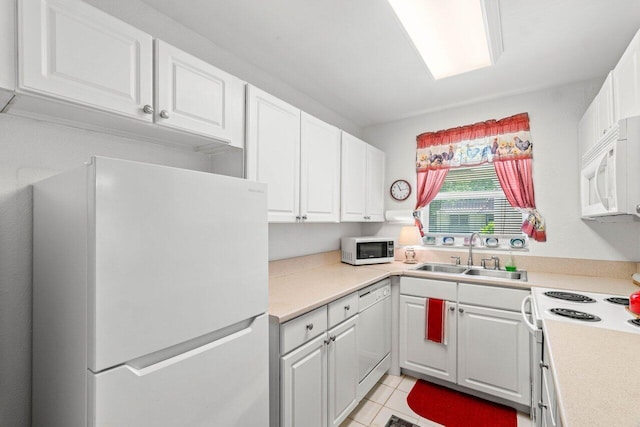 1124 NW 13th St Unit 204A, Boca Raton, FL 33486 - kitchen featuring white appliances, white cabinetry, light countertops, and light tile patterned flooring