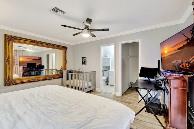 557 SW Violet Ave, Port Saint Lucie, FL 34983 - bedroom featuring ornamental molding, light wood-type flooring, ensuite bathroom, and a ceiling fan