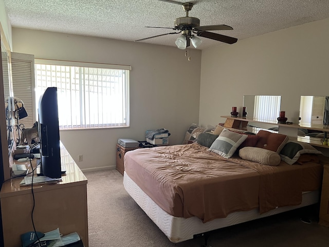 3623 La Playas Ct Unit A-1, Greenacres, FL 33463 - carpeted bedroom with a textured ceiling and a ceiling fan