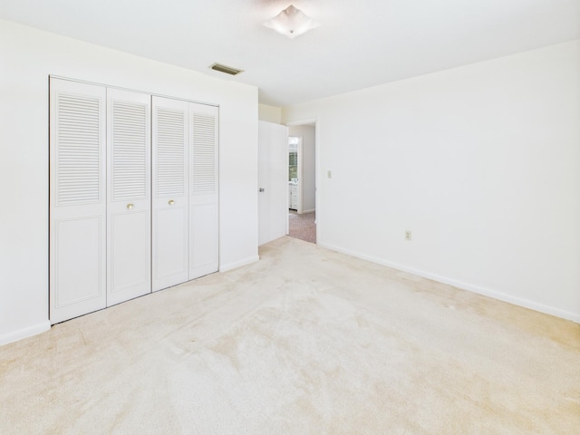 810 SE 13th St, Okeechobee, FL 34974 - unfurnished bedroom featuring carpet flooring and a closet