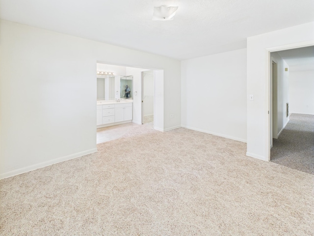 810 SE 13th St, Okeechobee, FL 34974 - spare room featuring light carpet and baseboards