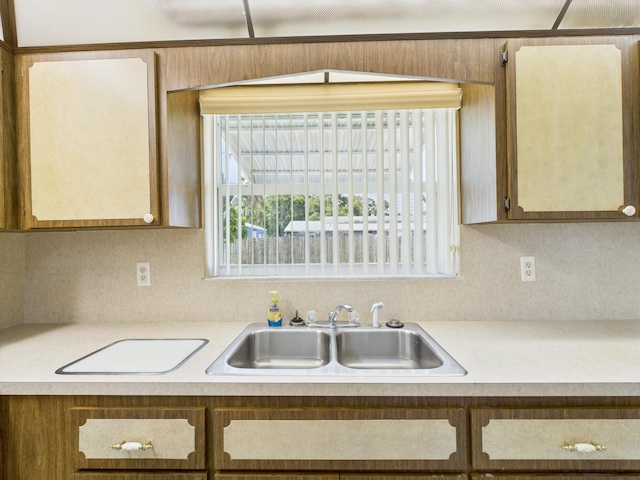 810 SE 13th St, Okeechobee, FL 34974 - kitchen with a sink and light countertops