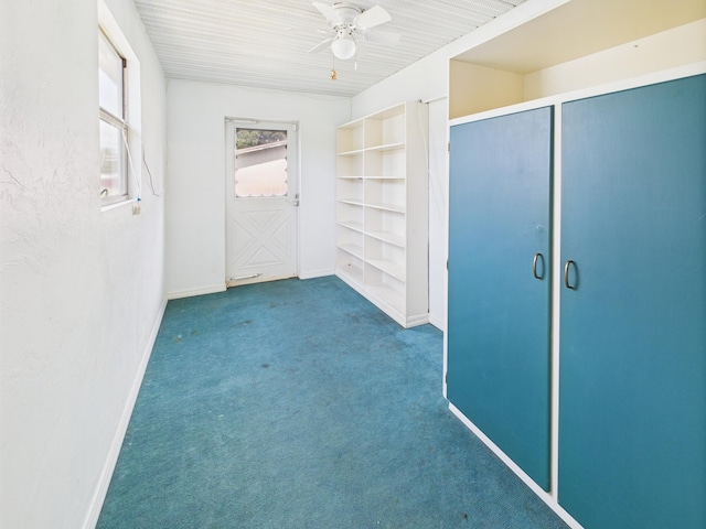 810 SE 13th St, Okeechobee, FL 34974 - unfurnished bedroom with carpet flooring, a ceiling fan, and two closets