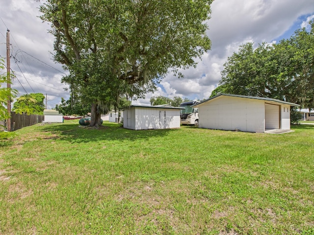 810 SE 13th St, Okeechobee, FL 34974 - view of yard featuring an outbuilding and a detached garage