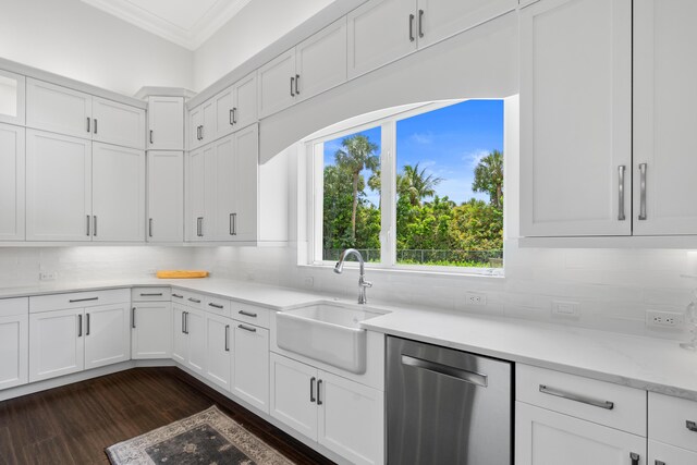 1257 Breakers W Blvd, West Palm Beach, FL 33411 - kitchen featuring stainless steel dishwasher, crown molding, dark wood-style flooring, and white cabinetry