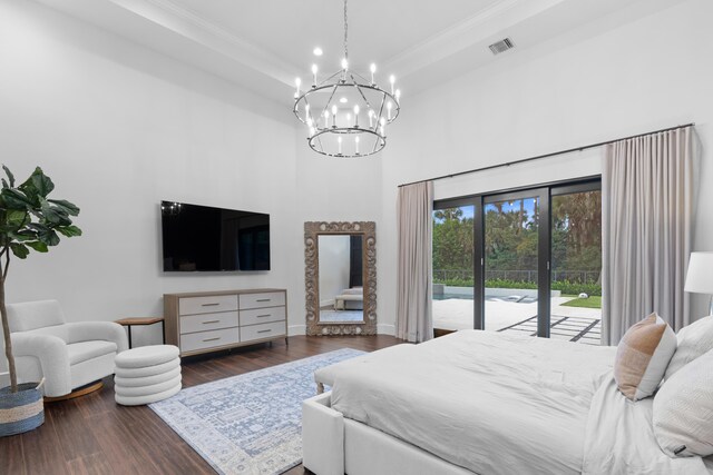 1257 Breakers W Blvd, West Palm Beach, FL 33411 - bedroom with access to exterior, a high ceiling, a chandelier, wood finished floors, and crown molding