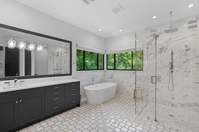 1257 Breakers W Blvd, West Palm Beach, FL 33411 - bathroom with a marble finish shower, a soaking tub, vanity, recessed lighting, and tile walls