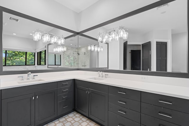 1257 Breakers W Blvd, West Palm Beach, FL 33411 - bathroom featuring double vanity, a stall shower, and tile patterned floors