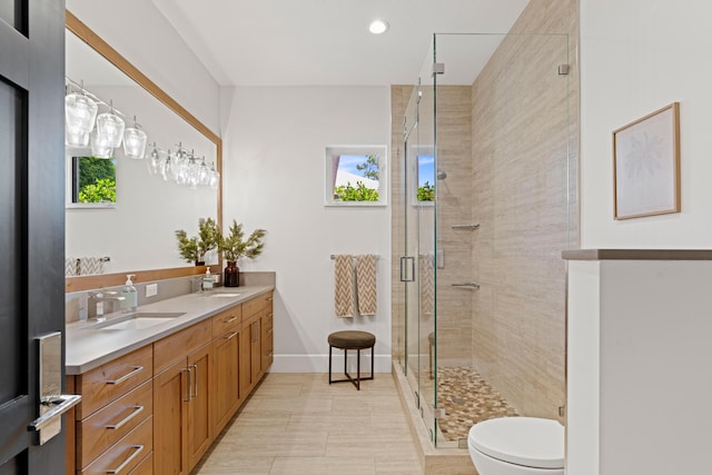 1257 Breakers W Blvd, West Palm Beach, FL 33411 - bathroom with double vanity, a shower stall, and recessed lighting