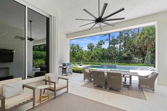 1257 Breakers W Blvd, West Palm Beach, FL 33411 - fenced backyard with ceiling fan, area for grilling, a patio, and view of scattered trees