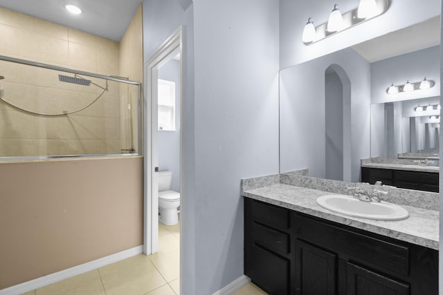 1842 SW Lofgren Ave, Port Saint Lucie, FL 34953 - full bath featuring a tile shower, vanity, and tile patterned flooring