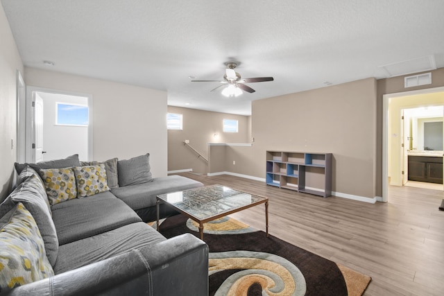 1842 SW Lofgren Ave, Port Saint Lucie, FL 34953 - living room featuring wood finished floors and ceiling fan