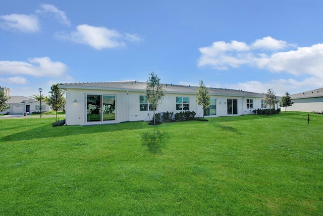 14511 Three Ponds Trl, Delray Beach, FL 33446 - back of property featuring a yard and stucco siding