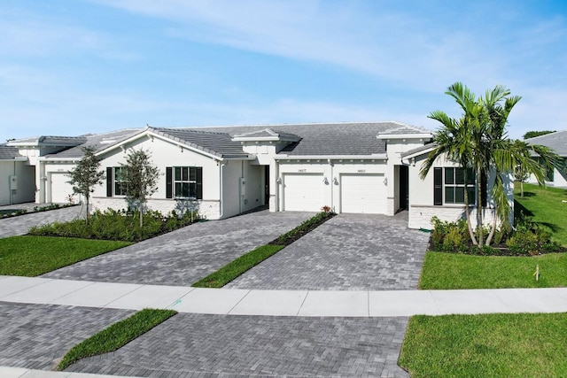 14511 Three Ponds Trl, Delray Beach, FL 33446 - ranch-style house with an attached garage, driveway, a front yard, stucco siding, and a tiled roof