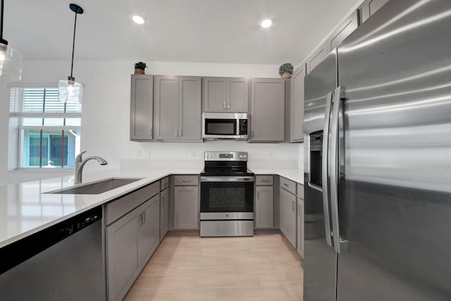 14511 Three Ponds Trl, Delray Beach, FL 33446 - kitchen featuring stainless steel appliances, gray cabinetry, light countertops, light wood finished floors, and recessed lighting
