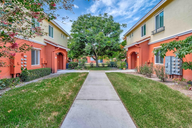 40 SE Sedona Cir Unit 104, Stuart, FL 34994 - view of property's community featuring a lawn