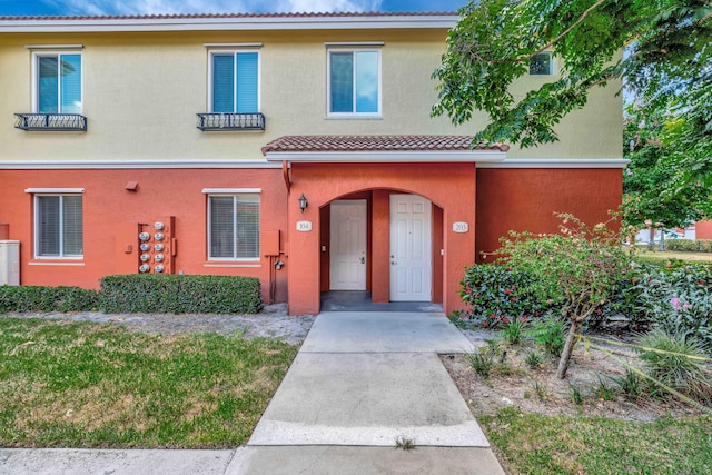 40 SE Sedona Cir Unit 104, Stuart, FL 34994 - view of front of property featuring stucco siding and a tile roof