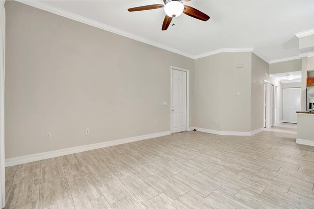 40 SE Sedona Cir Unit 104, Stuart, FL 34994 - empty room featuring a ceiling fan, ornamental molding, and light wood-type flooring
