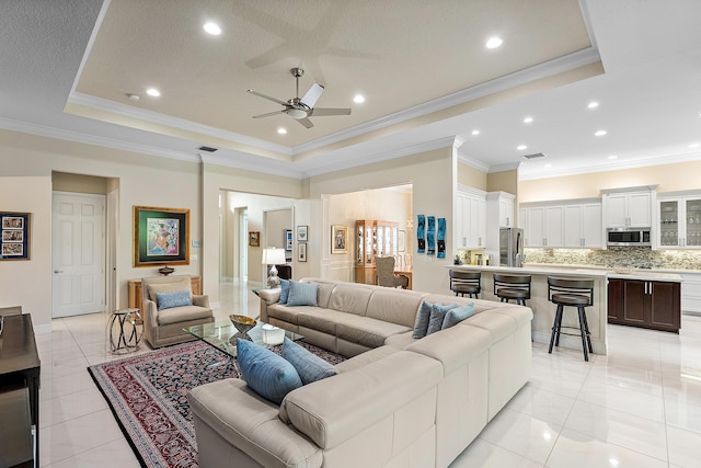 8271 Green Mountain Rd, Boynton Beach, FL 33473 - living area with a raised ceiling, a ceiling fan, crown molding, and recessed lighting