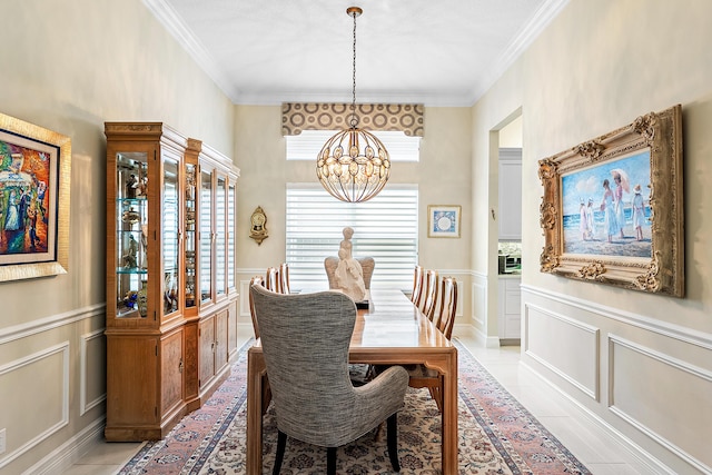 8271 Green Mountain Rd, Boynton Beach, FL 33473 - dining area with a chandelier, a decorative wall, crown molding, wainscoting, and light tile patterned flooring