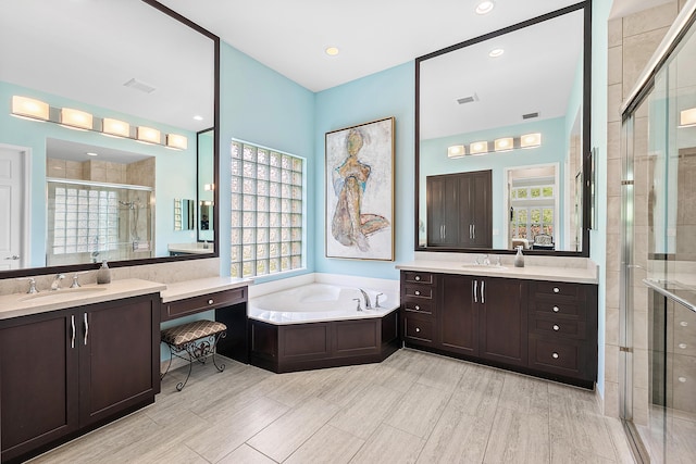 8271 Green Mountain Rd, Boynton Beach, FL 33473 - bathroom featuring a shower stall, two vanities, a bath, and recessed lighting