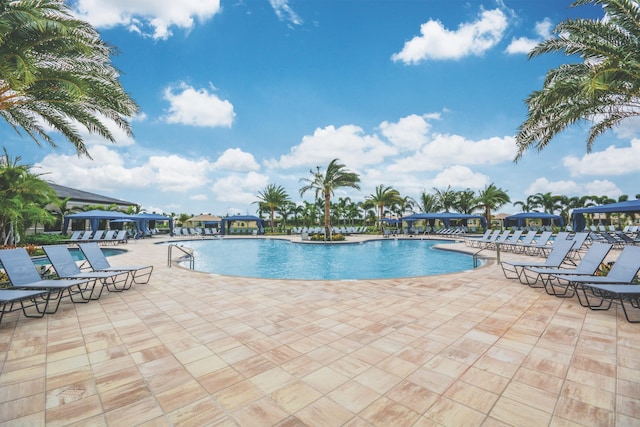 8271 Green Mountain Rd, Boynton Beach, FL 33473 - community pool featuring a patio