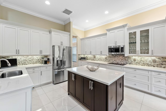 8271 Green Mountain Rd, Boynton Beach, FL 33473 - kitchen with stainless steel appliances, backsplash, white cabinets, crown molding, and recessed lighting