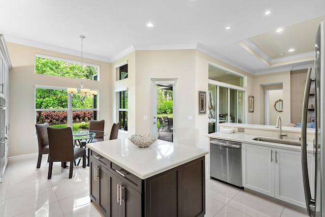 8271 Green Mountain Rd, Boynton Beach, FL 33473 - kitchen featuring appliances with stainless steel finishes, ornamental molding, light tile patterned flooring, plenty of natural light, and recessed lighting