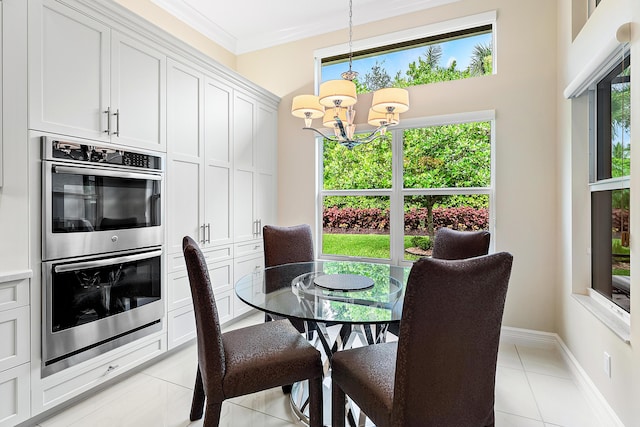 8271 Green Mountain Rd, Boynton Beach, FL 33473 - dining area featuring light tile patterned floors, a chandelier, plenty of natural light, and ornamental molding