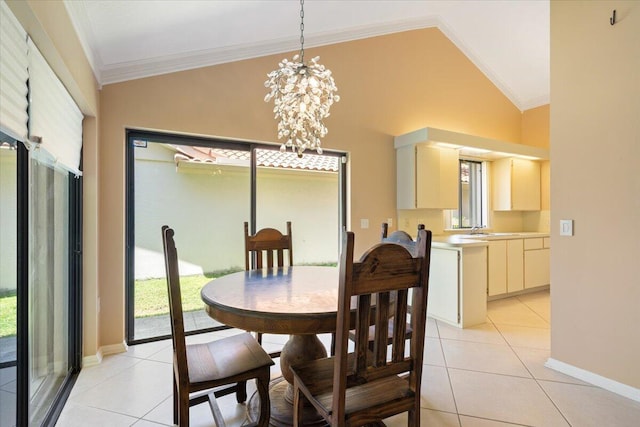 2646 Mohawk Cir, West Palm Beach, FL 33409 - dining room featuring light tile patterned flooring, plenty of natural light, a chandelier, crown molding, and high vaulted ceiling