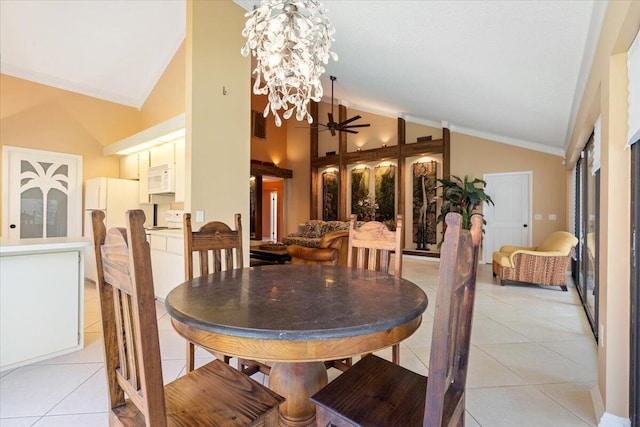 2646 Mohawk Cir, West Palm Beach, FL 33409 - dining space with light tile patterned floors, a chandelier, ornamental molding, and high vaulted ceiling
