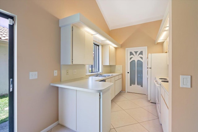 2646 Mohawk Cir, West Palm Beach, FL 33409 - kitchen with crown molding, a peninsula, light countertops, electric stove, and light tile patterned floors