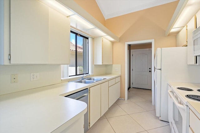 2646 Mohawk Cir, West Palm Beach, FL 33409 - kitchen with white appliances, ornamental molding, light countertops, and light tile patterned floors
