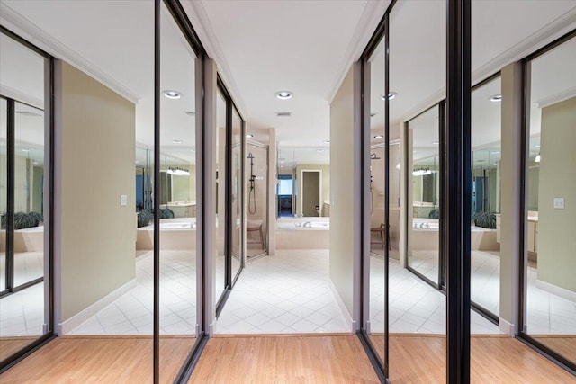 2646 Mohawk Cir, West Palm Beach, FL 33409 - hallway featuring light tile patterned flooring and ornamental molding